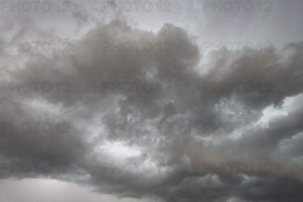 Dark discoloured storm clouds Cloud roll above grey clouds Rain clouds herald thunderstorms,