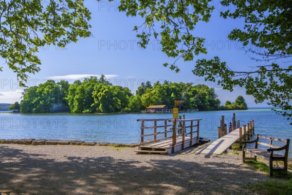 Bell jetty on the lakeshore with a view of Roseninsel in Lake Starnberg, Feldafing, Upper Bavaria,
