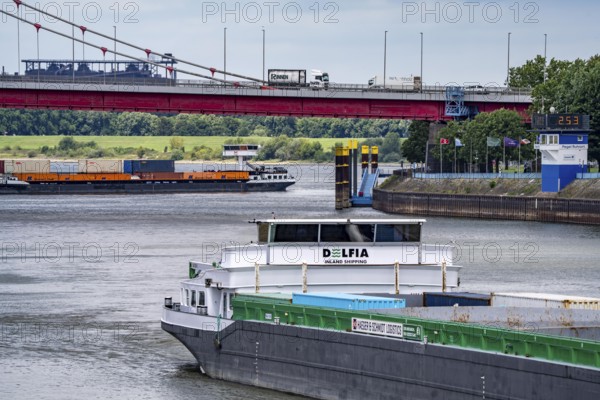 Barge enters the Vinckekanal, in the harbour of Ruhrort, container freighter on the Rhine, on an