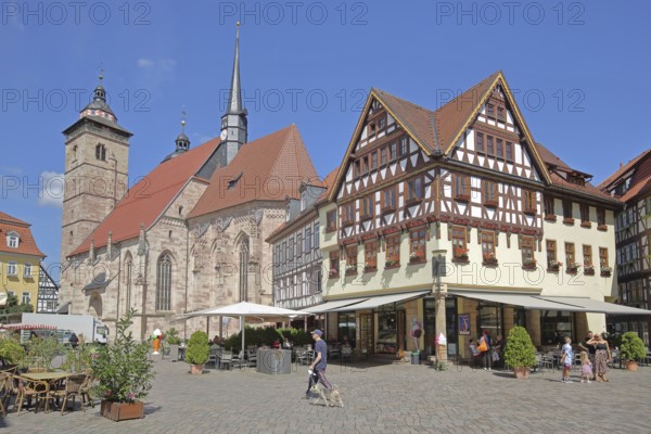 Late Gothic St George's Church and half-timbered houses with pedestrians, Altmarkt, Schmalkalden,