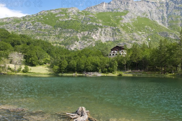 View of mountain lake Lago Grande near Moncenisio in Val Cenischia in the Graian Alps, behind it