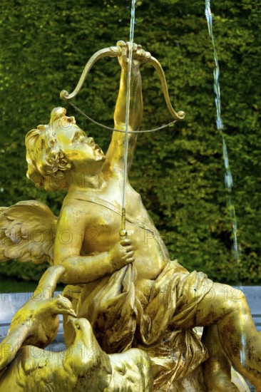 Fountain figure of Cupid, god of love, in gold with bow and arrow, Rococo style, east parterre,
