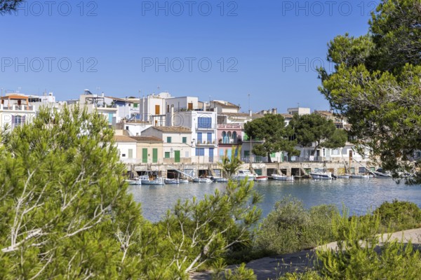 Portocolom fishing village on Majorca with boats and colourful houses Holiday by the sea in