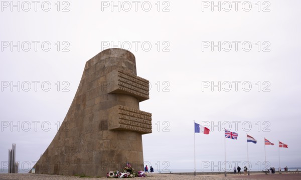 Memorial to the landing of the US V Corps on 6 June 1944, Les Braves on the left, memorial by