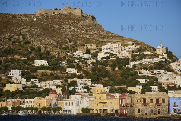 Panteli Fortress, coastal landscape with white houses on a hill and a fortress on top, Agia Marina,
