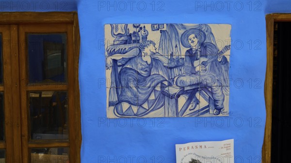 Restaurant Mylos, Blue wall tiles with a musician and a woman in a living room, Agia Marina, Leros,