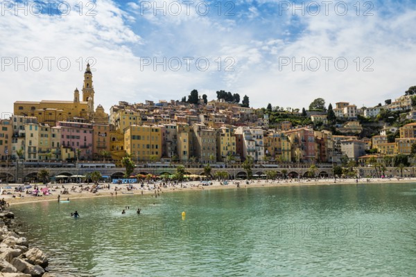 Town with colourful houses by the sea, Plage des Sablettes, Menton, Alpes Maritimes, Provence Alpes