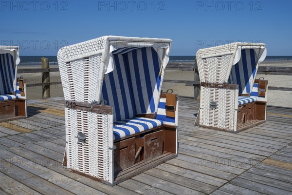 Beach chairs on wooden planks, Sankt Peter Ording, Eiderstedt, North Frisia, North Sea,