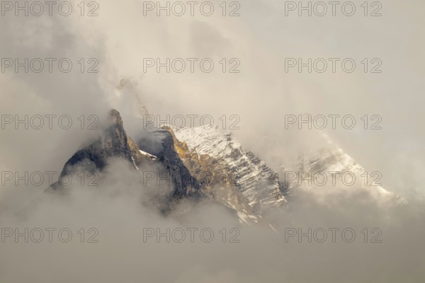 Small and large Bettelwurf with a thin layer of snow, behind wispy clouds, Small and large