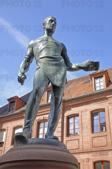 Cobbler's fountain with cobbler Johann Joß sculpture as a symbol of the former shoe industry and