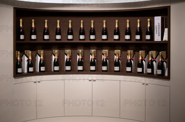 Various bottle sizes of Champagne Impérial Brut, logo, lettering, showroom, reception hall,