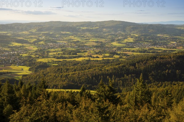 View of the Odenwald from the drum tower in Rimbach. Towns, forest, meadows, fields. Sunset.