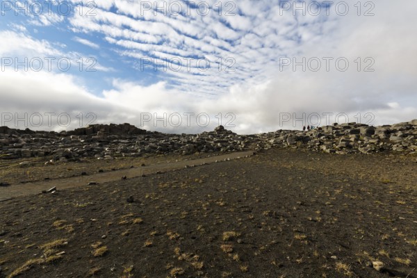Hiker, hiking trail between Dettifoss and Selfoss, volcanic landscape, Cumulus, North Iceland,