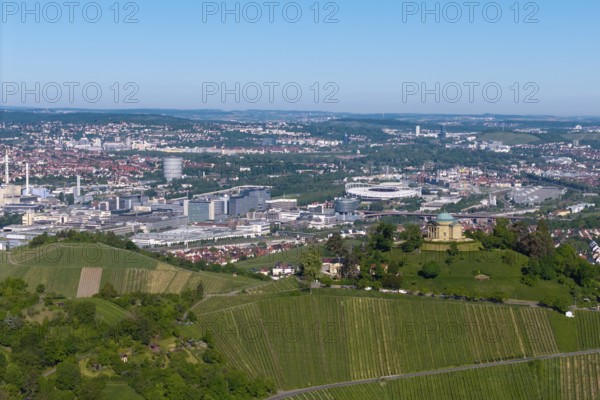 Panoramic picture of a cityscape with a building on a vineyard hill, view of the burial chapel of