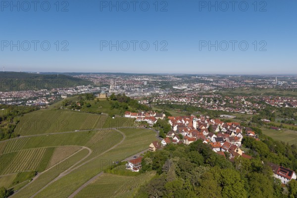 Panorama of a town with vineyards and red roofs under a clear sky, view of Rotenberg near Stuttgart