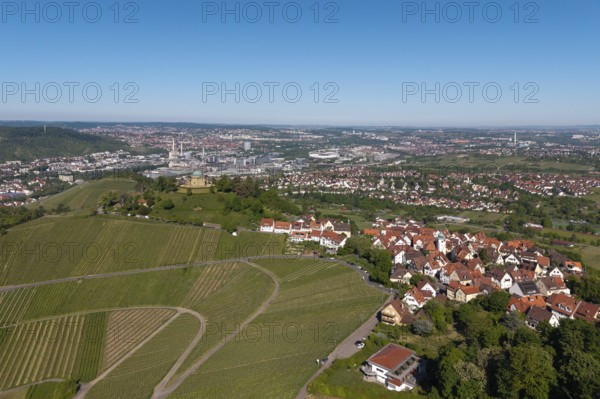 City with surrounding vineyards and landscape under a clear sky, view of Rotenberg near Stuttgart