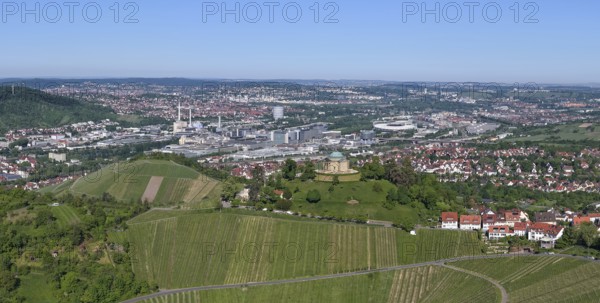 View of a cityscape with vineyards and hills under a blue sky, view of Rotenberg near Stuttgart