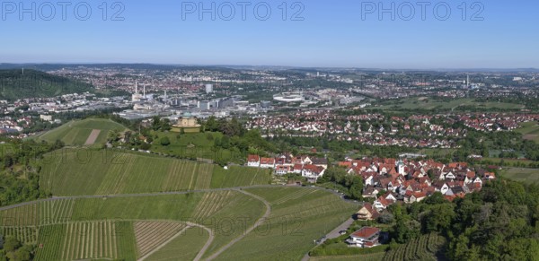 Panoramic view of a town with surrounding vineyards under a clear blue sky, view of Rotenberg near