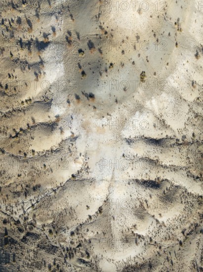 Broken, rocky ground with sparse vegetation. Aerial view. Drone shot. Southern Namibia