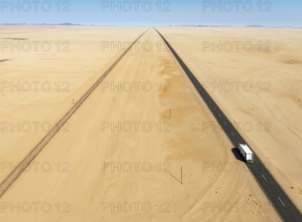 Rails and the B4 tarred road between Aus and Lüderitz in the southern Namib Desert. Aerial view.