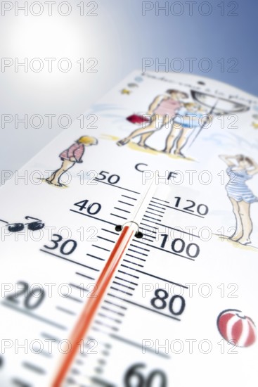 Worm's-eye view of thermometer measures extremely hot temperature of 40 degrees Celsius, 40 °C, 100