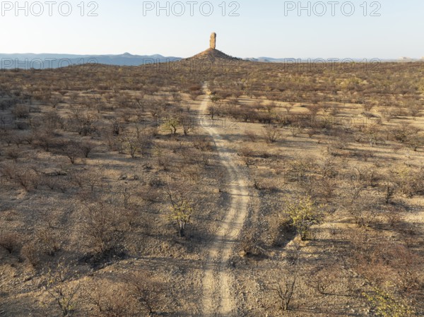 The Vingerklip (rock finger) is surrounded by thornbush and mopane (Colophospermum mopane) savanna.