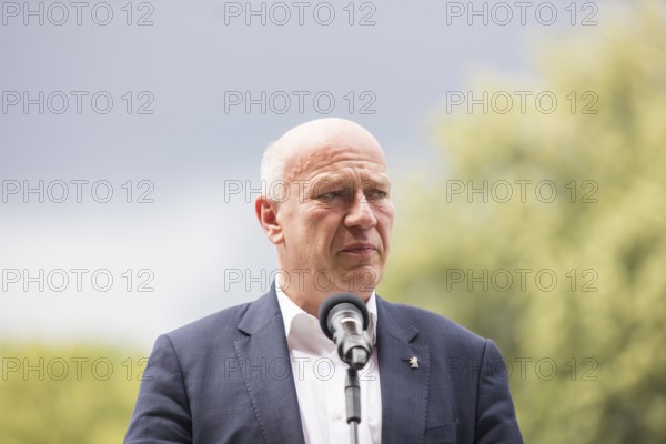 Kai Wegner (Governing Mayor of Berlin) gives a speech in front of the raising of the rainbow flag
