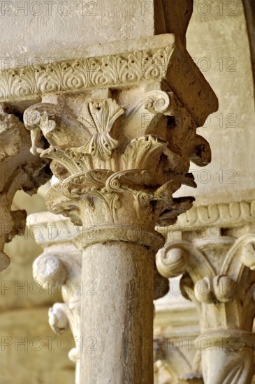 Slender Gothic columns with filigree capitals in the cloister, Gothic basilica of the Cistercian