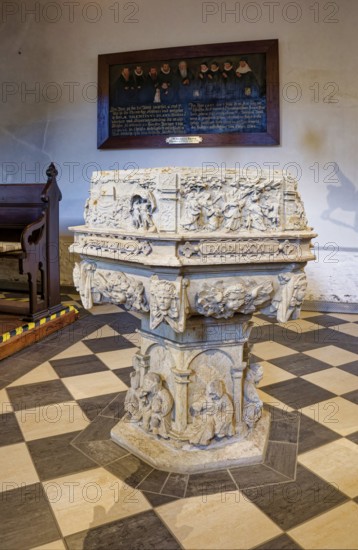 Baptismal font, sandstone baptismal font from the Renaissance period from 1603, created by H.