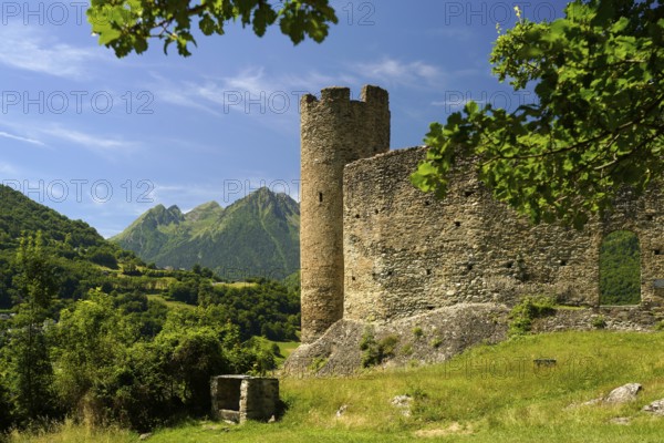 The ruins of the Château Sainte-Marie castle in Esterre and the mountain landscape near