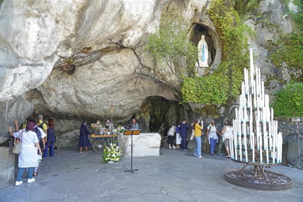 The Grotto of Massabielle in the Holy District in the Marian pilgrimage town of Lourdes, Pyrenees,