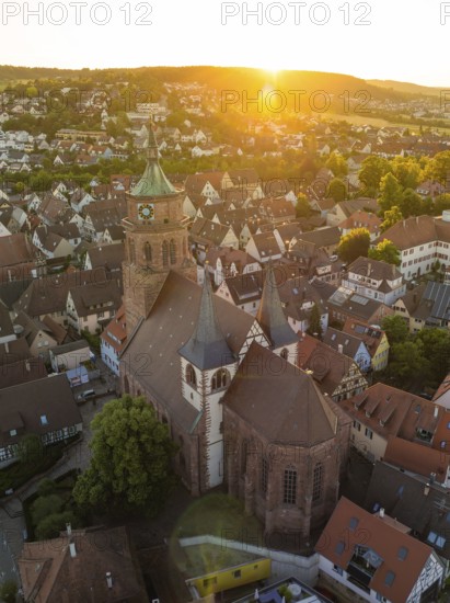 Picturesque view of a church and town at sunset with historical buildings and roof landscapes, 950