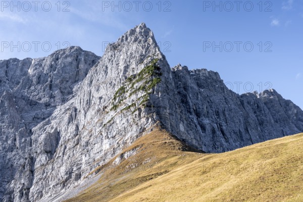 Rocky mountain ridge, mountain landscape in autumn in the morning light, rocky mountain peak