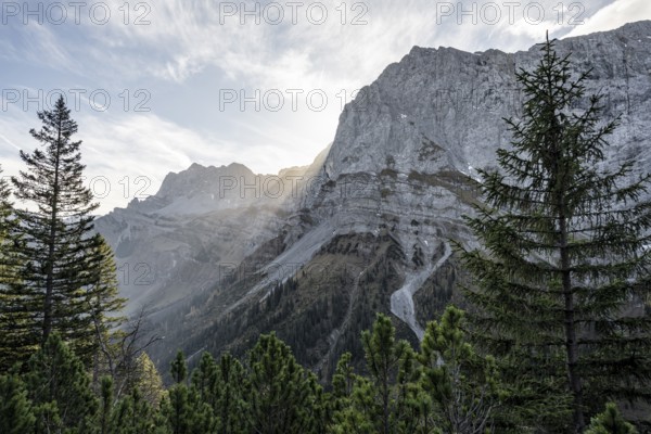 Sunbeams fall over a rocky mountain ridge, Mountain landscape in autumn in the morning light, Rocky
