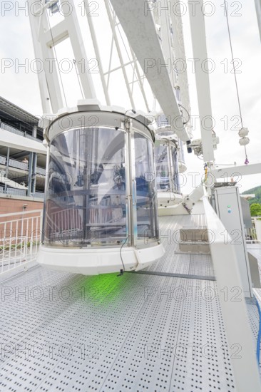 Close-up of a gondola of a Ferris wheel, shown in detailed surroundings, Ferris wheel construction,