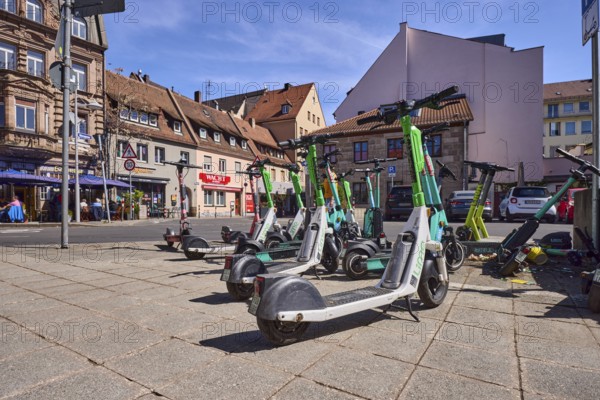 E-scooter in the city, problem, traffic problem, general architecture, pavement, pavement slabs,