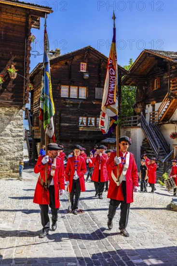 Pipers and drummers accompany the Corpus Christi procession, historic town centre, Grimentz, Val