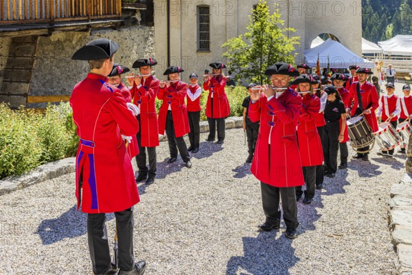 Pipers and drummers line up for the Corpus Christi procession, historic village centre, Grimentz,