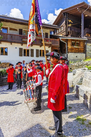 Pipers and drummers play in the historic village centre, Grimentz, Val d'Anniviers, Valais Alps,