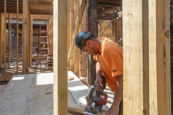 Detroit, Michigan - Jay Newcomb III helps rehab a long-vacant and crumbling commercial building in