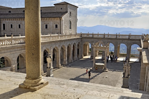 Bramante cloister with cistern and statues of St Benedict and St Scholastica of Nursia, Benedictine