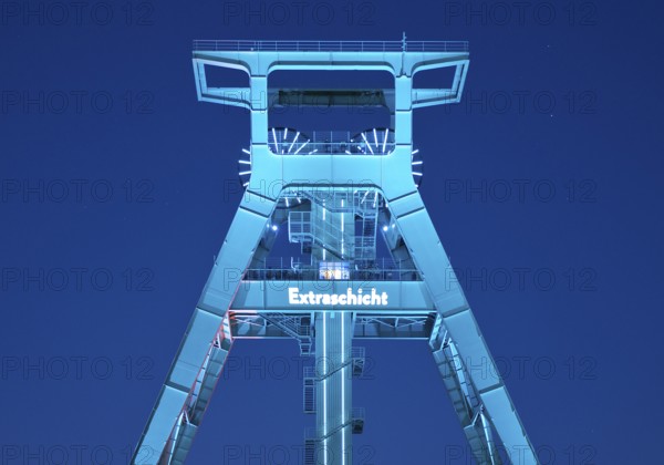 Illuminated headframe of the German Mining Museum at Extraschicht, Bochum, Ruhr area, North