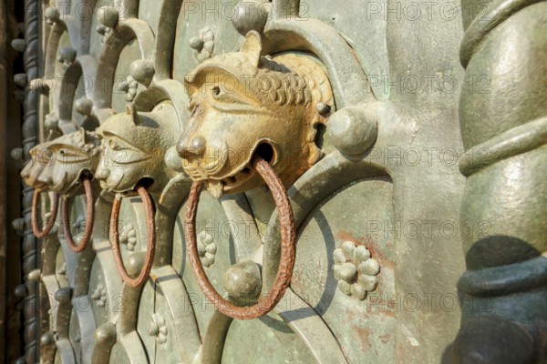 Lion heads on the main portal of the Roman Catholic Basilica of St Mark on St Mark's Square,