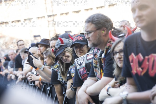 Fans in the front row in front of the concert of AC/DC live on Power Up Tour 2025 at the