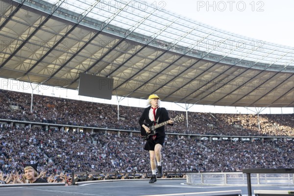 Angus Young, lead guitarist of AC/DC live on Power Up Tour 2025 at the Olympiastadion Berlin on 30