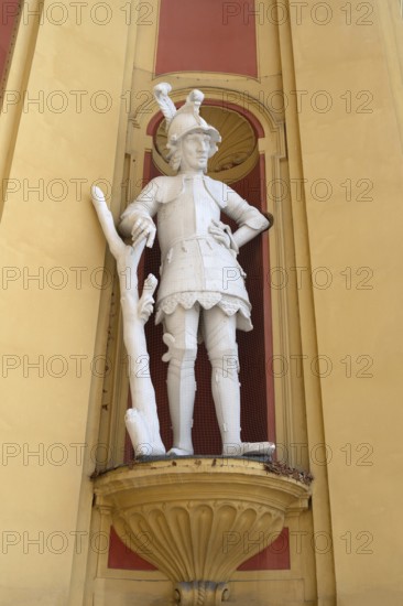 Sculpture of the giant Thyrsus, legendary figure, at the entrance portal of Wilten Abbey,
