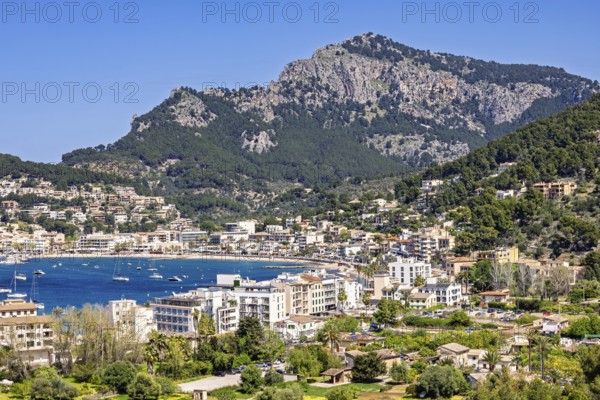 View at the idyllic coast village Port de Soller a famous tourist resort with houses around the