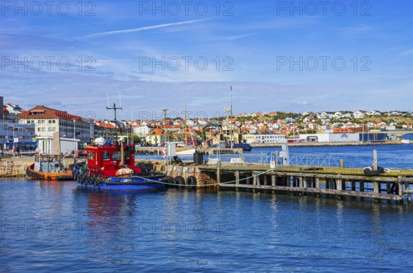 Picturesque scenery of small tugboats in the harbour of Lysekil, Bohuslän, Västra Götalands län,