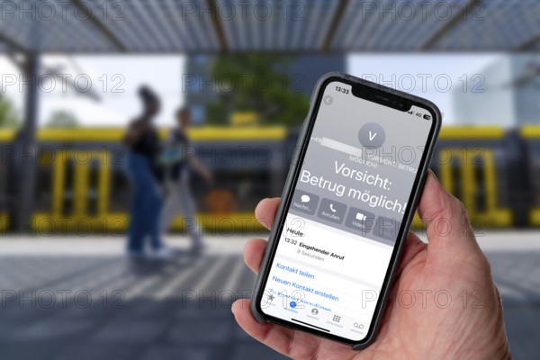 Symbolic image of mobile phone scam, warning of fraudulent calls, here the provider Vodafone, warns
