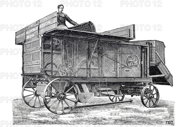Agriculture, threshing machine with protective device by Eckert, around 1860, digitally improved